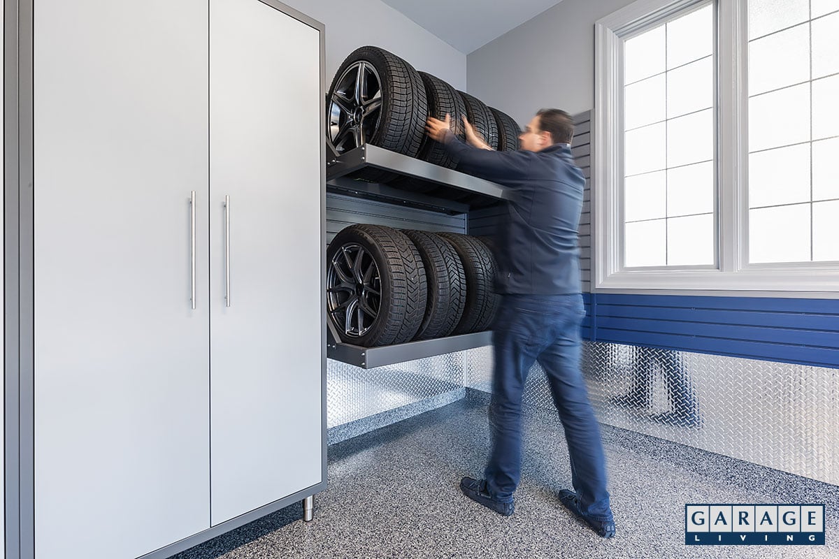 winter garage makeover man in front of tire rack